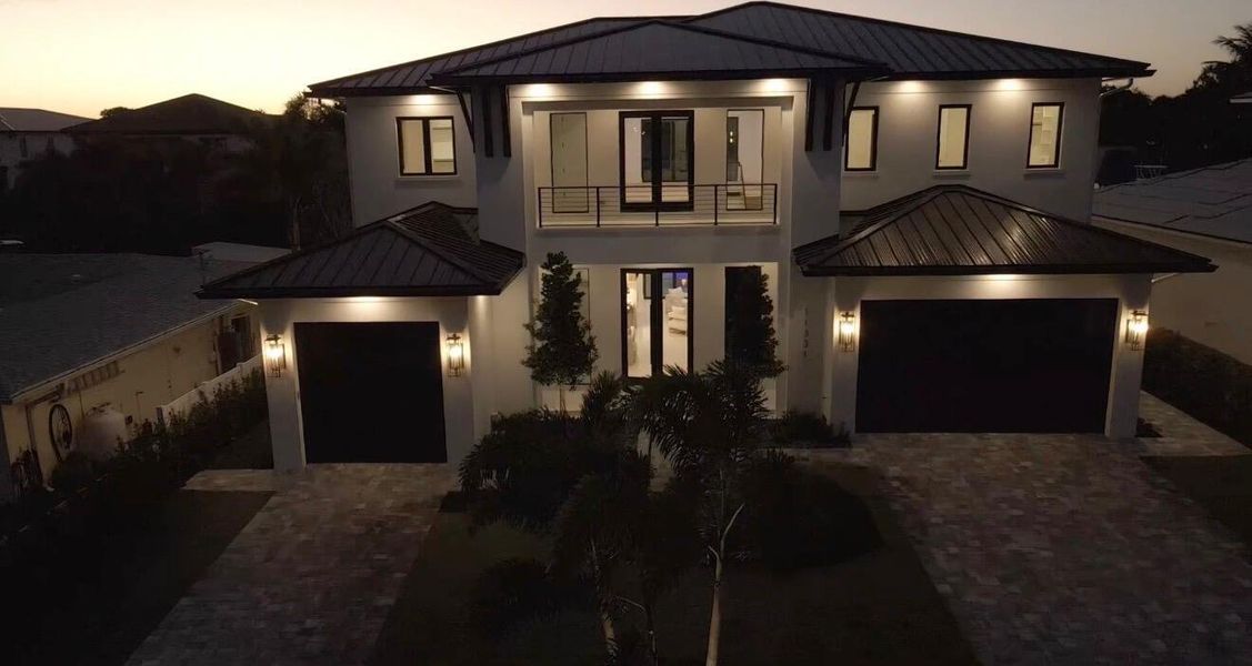 Front exterior of a new home in , Palm Beach Gardens, FL, highlighting curb appeal (Image 31). Front exterior of a new home in , Palm Beach Gardens, FL, highlighting curb appeal (Image 31).