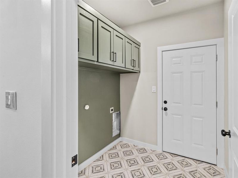 Washroom with cabinet space and electric dryer hookup
