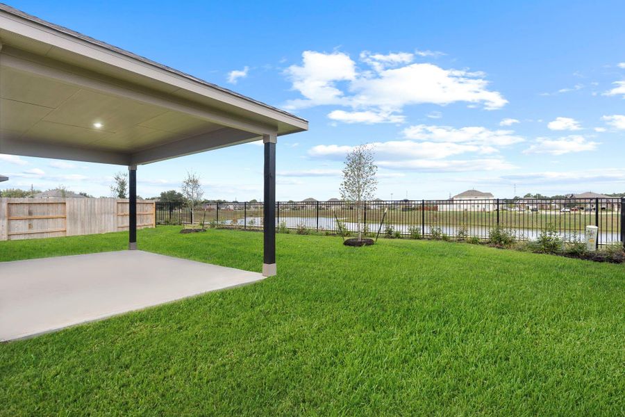 Another angle of the extended patio showing its generous space and durable construction, perfect for adding outdoor furniture or a cozy lounge setup. Another angle of the extended patio showing its generous space and durable construction, perfect for adding outdoor furniture or a cozy lounge setup.
