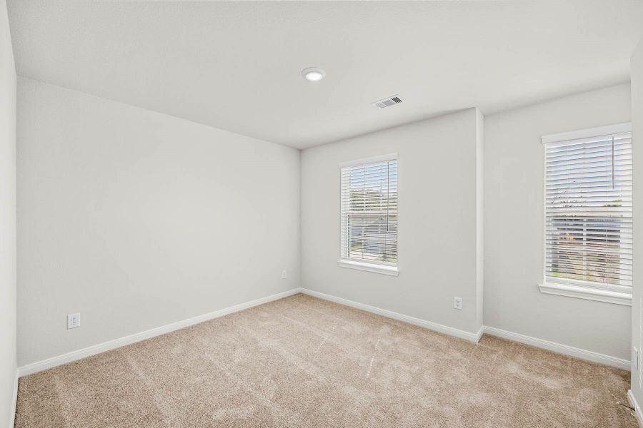 One of the three additional bedrooms in the home. One of the three additional bedrooms in the home.
