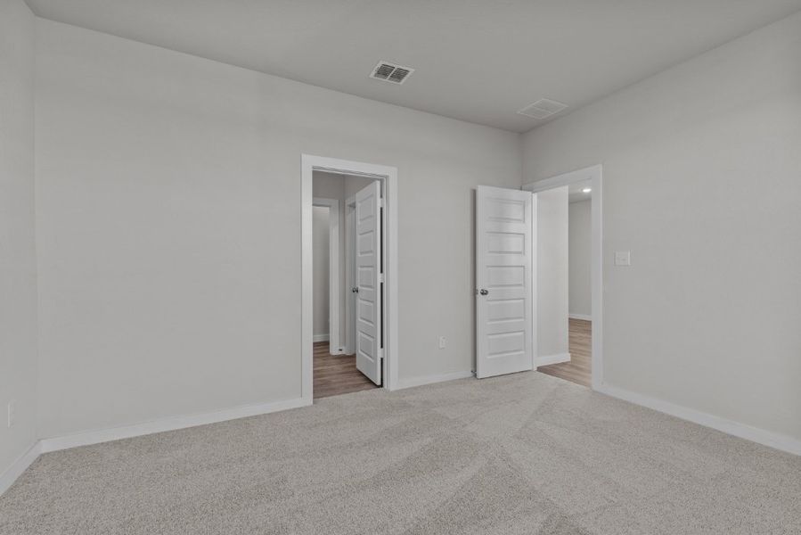 A hallway with white walls.