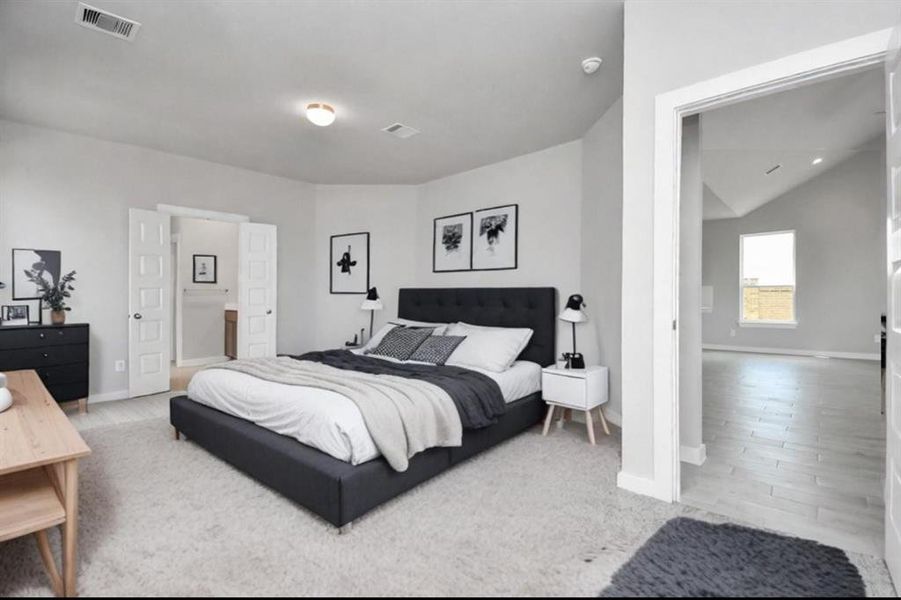 Escape to tranquility in this spacious primary room, adorned with plush carpeting and bathed in the soothing hues of warm paint colors, creating a cozy retreat for relaxation. Sample photo, virtually staged.