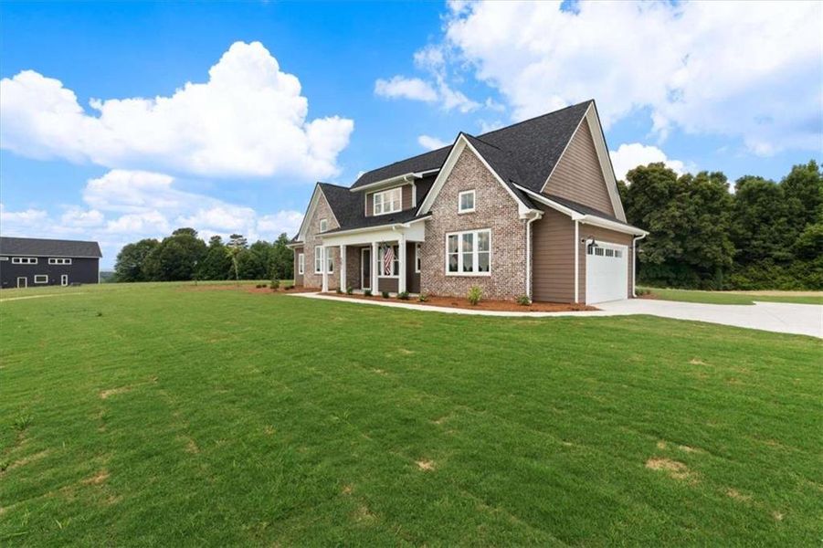 Front exterior of a new home in , Roopville, GA, highlighting curb appeal (Image 25).