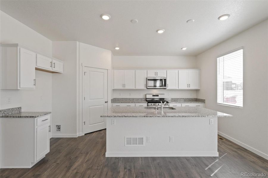Furnished interior view inside a new home in Trails at Crowfoot, Parker (Image 7).