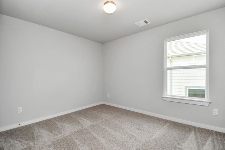 Generously sized secondary bedrooms, complete with spacious closets and soft, inviting carpeting. Sample photo, actual color and selections can vary. Generously sized secondary bedrooms, complete with spacious closets and soft, inviting carpeting. Sample photo, actual color and selections can vary.
