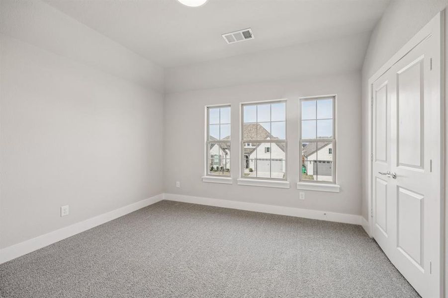 Unfurnished bedroom featuring baseboards and light colored carpet Unfurnished bedroom featuring baseboards and light colored carpet