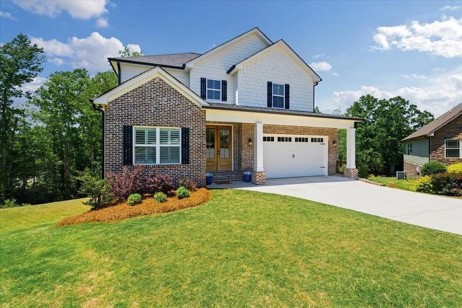 Front exterior of a new home in , Carrollton, GA, highlighting curb appeal (Image 22).
