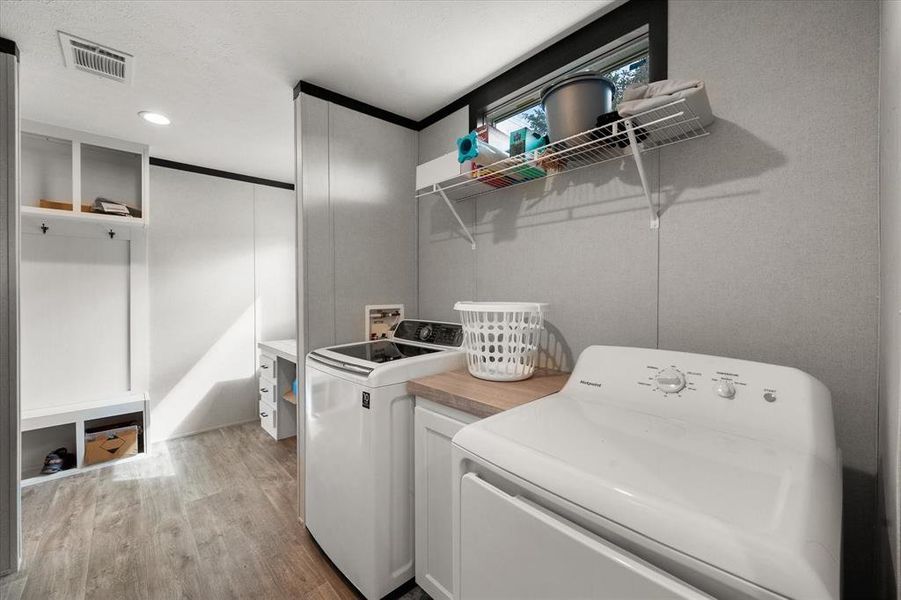 Laundry room, open to the desk & mudroom cubby. Laundry room, open to the desk & mudroom cubby.