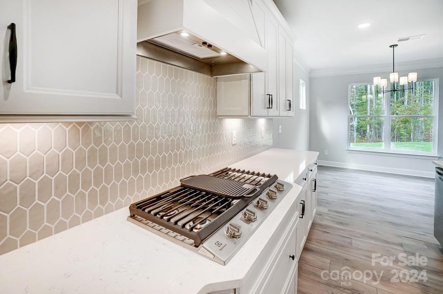 Stainless Steel Appliances included, featuring Gas Cooktop and Designer Shiplap Range Hood