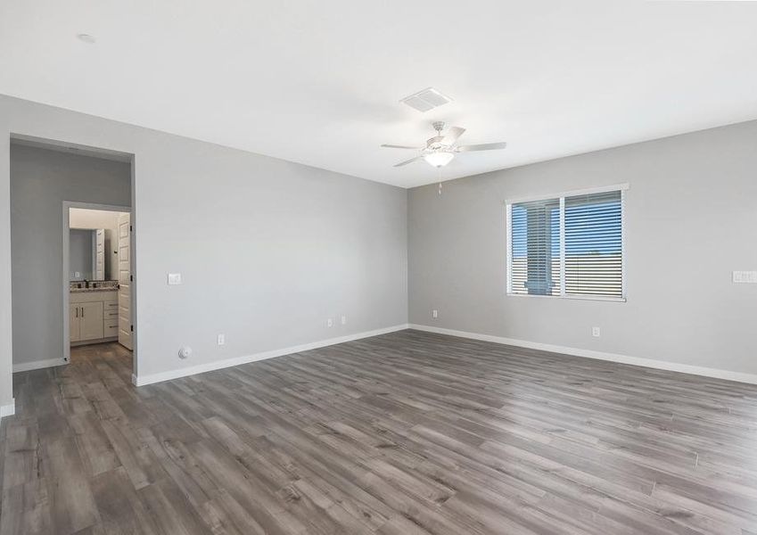 Spacious living room that connects to the hallway and guest bathroom.