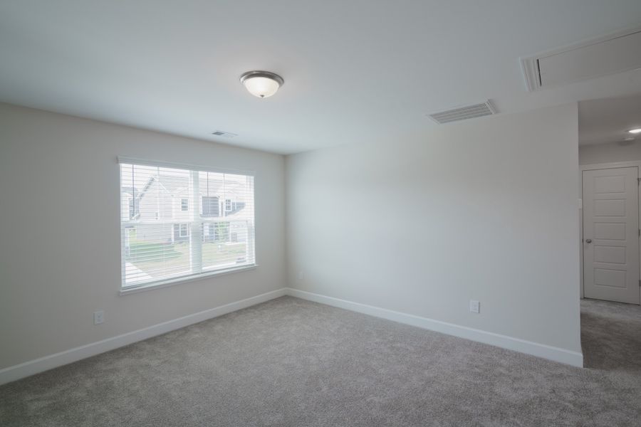 Representative unfurnished interior of a home built from the The Holland by Cothran Homes in Holly Ridge, Greenville (Image 30).