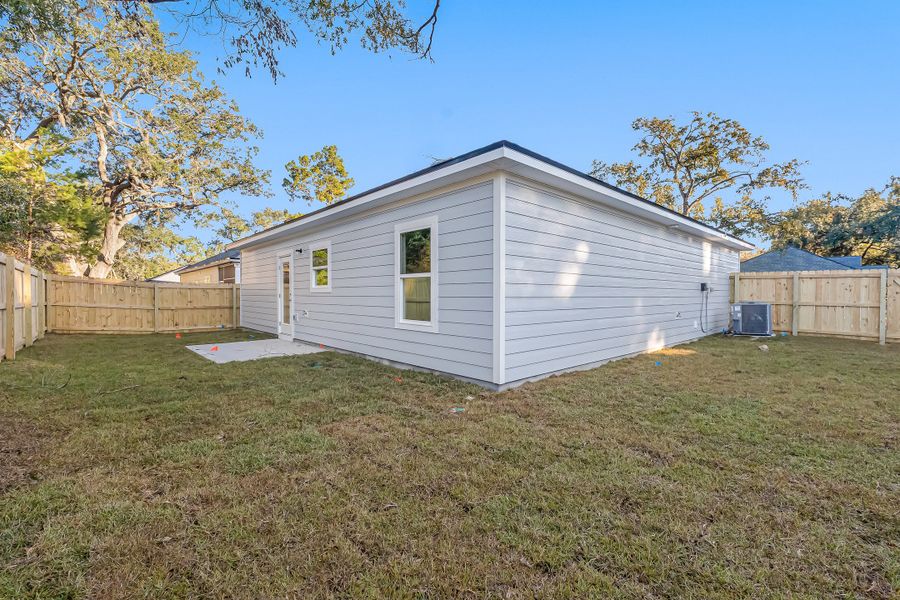 Exterior details and patio area of a home in Live Oak Cottages, Freeport (Image 31). Exterior details and patio area of a home in Live Oak Cottages, Freeport (Image 31).
