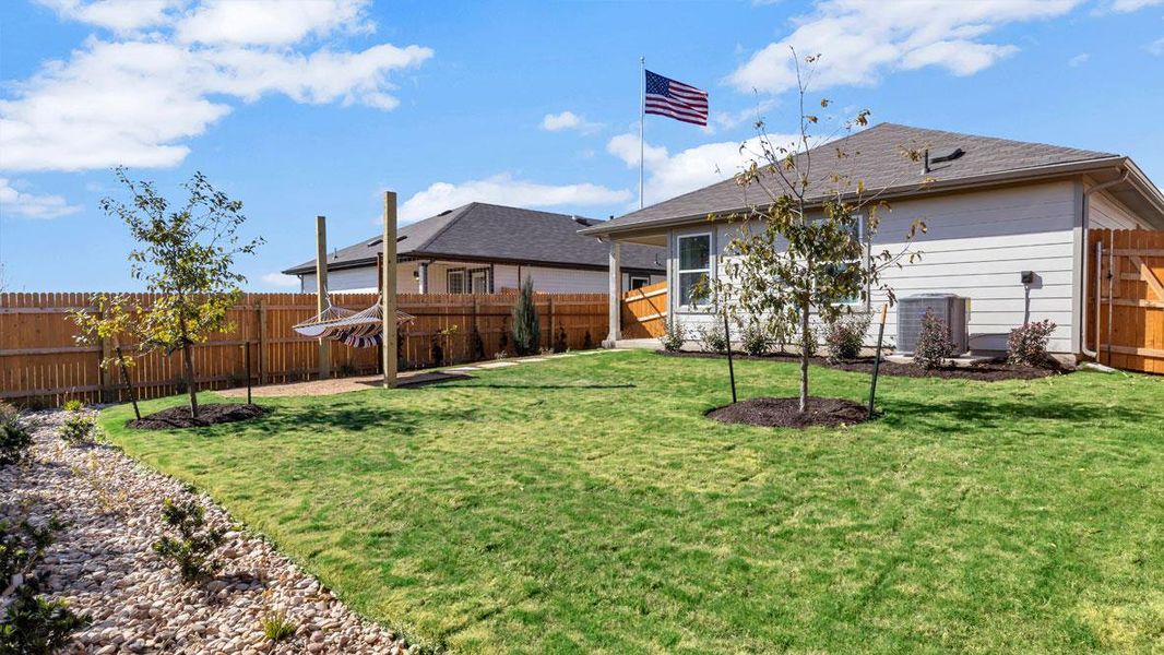 Front exterior of a new home in Prairie Lakes, Buda, TX, highlighting curb appeal (Image 19).