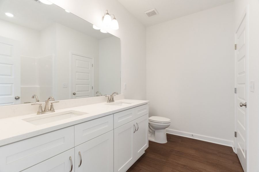 Furnished interior in a model home at Homewood Estates in Crestview (Image 13).