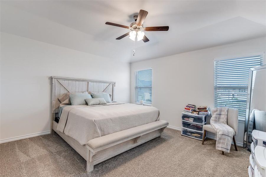 Bedroom with light colored carpet and ceiling fan Bedroom with light colored carpet and ceiling fan