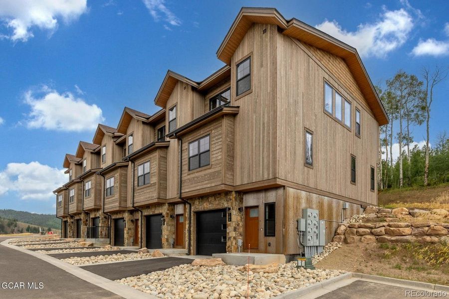 Front exterior of a new home in , Granby, CO, highlighting curb appeal (Image 26).