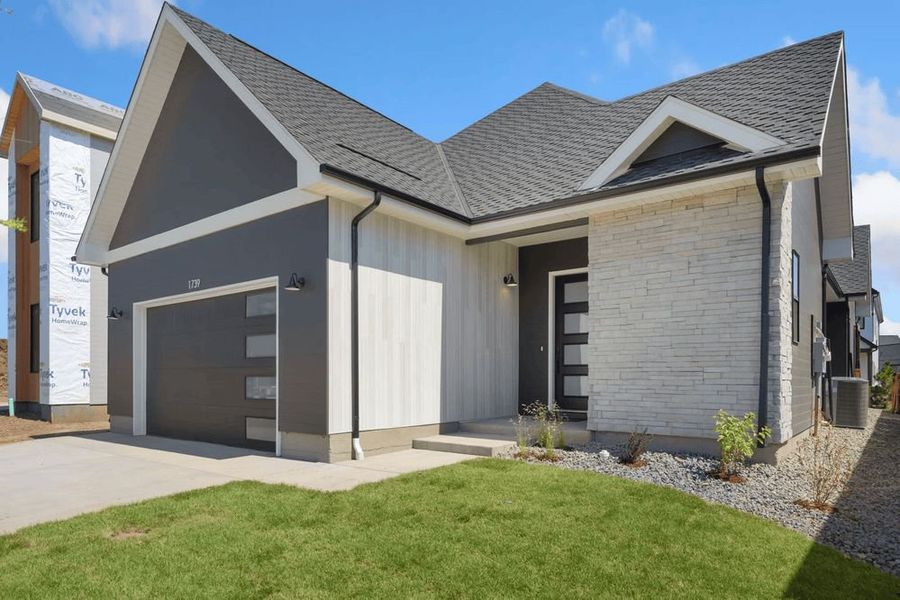 Representative exterior photo of a completed home built from the The Baja by Trumark Homes in Pelican Shores at Water Valley, Windsor, CO (Image 15).