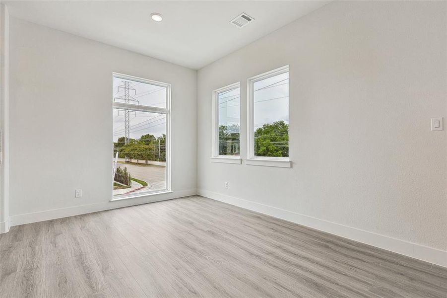 Empty room featuring light wood-type flooring