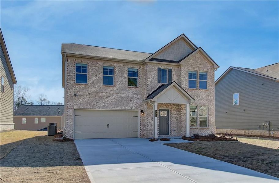Front exterior of a new home in Cedar Grove Commons, Conley, GA, highlighting curb appeal (Image 14). Front exterior of a new home in Cedar Grove Commons, Conley, GA, highlighting curb appeal (Image 14).