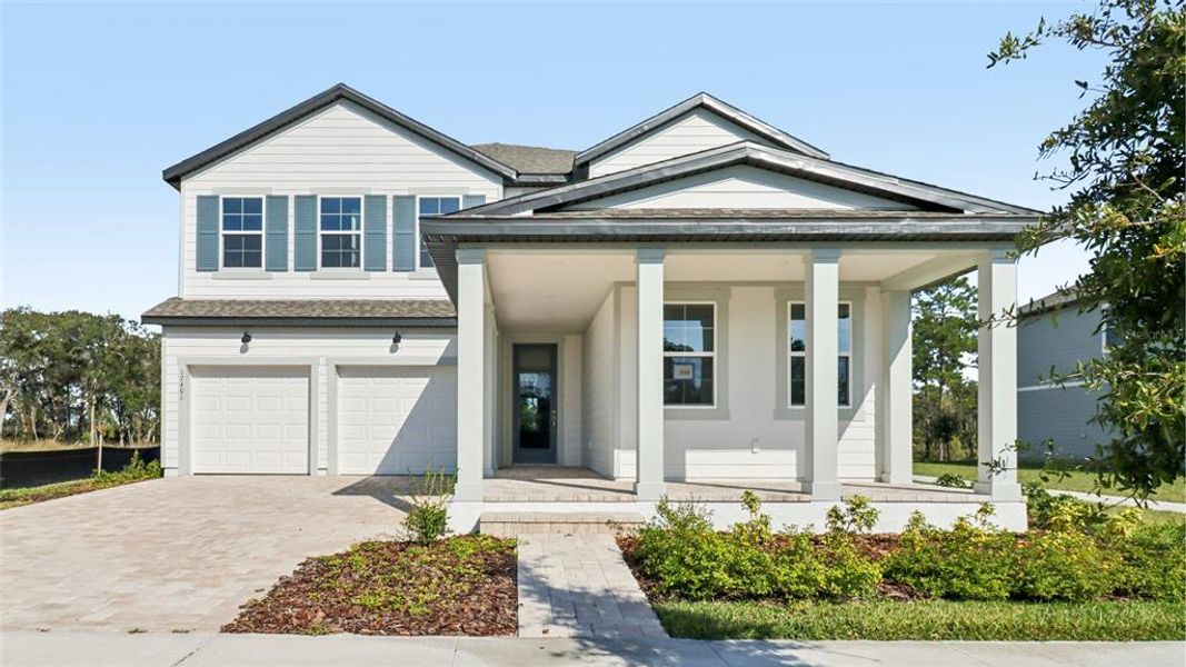 Front exterior of a new home in Northlake Traditional, Winter Garden, FL, highlighting curb appeal (Image 2).