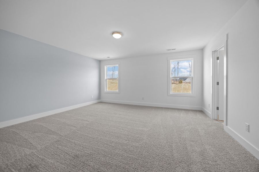 Representative unfurnished interior of a home built from the Blue Satin Sashes by Garman Homes in Spring Valley, Trinity (Image 11).