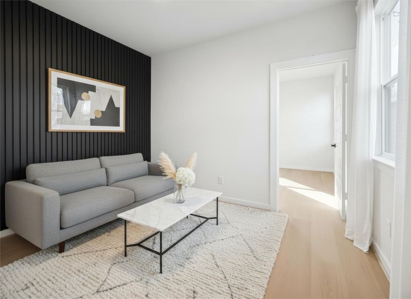 Shot of the guest suite shows a flexible space ideal for a workout room, study, game room, TV room, or cozy reading area. This versatile room flows directly into a private bedroom with an ensuite bath, offering comfort and convenience for guests or everyday use. *Virtually staged and painted wall*