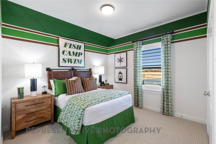 Carpeted bedroom with baseboards
