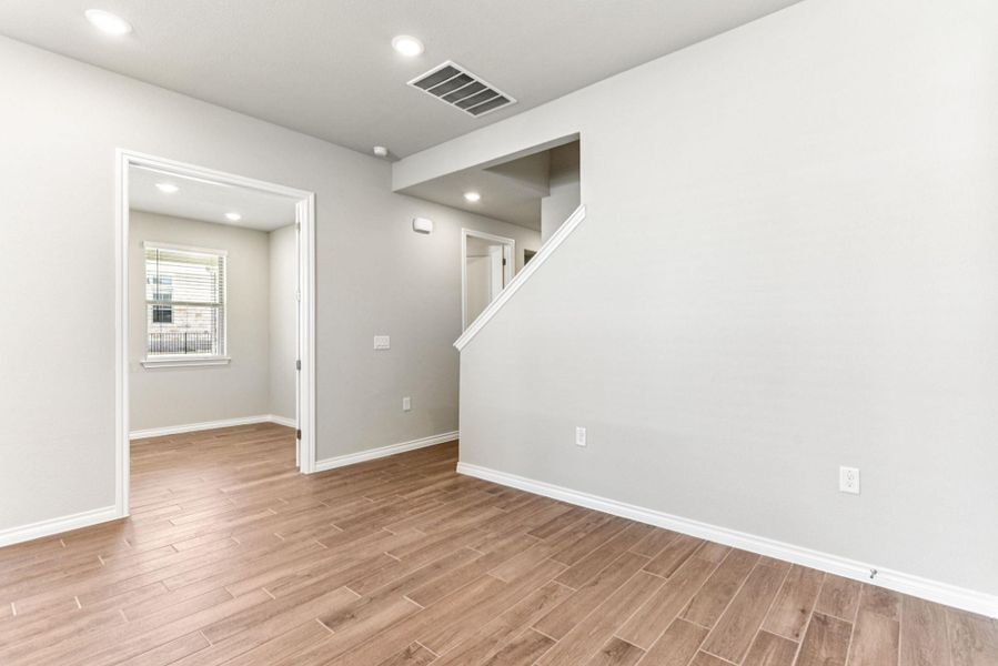 Unfurnished room featuring recessed lighting and light wood-style flooring Unfurnished room featuring recessed lighting and light wood-style flooring