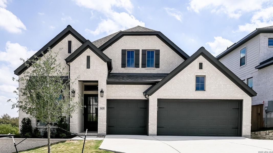 Front exterior of a new home in Johnson Ranch, Bulverde, TX, highlighting curb appeal (Image 17).
