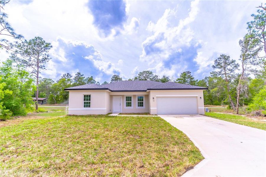 Front exterior of a new home in , Ocala, FL, highlighting curb appeal (Image 15).