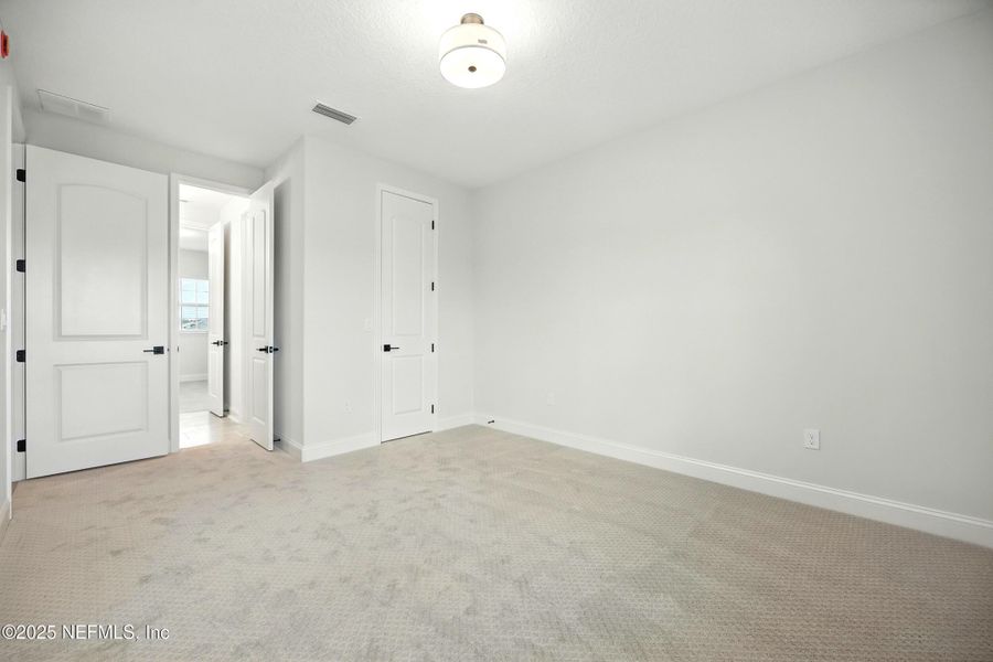 Spacious, unfurnished interior of a new home in Silver Landing At Silverleaf, St. Augustine (Image 30).