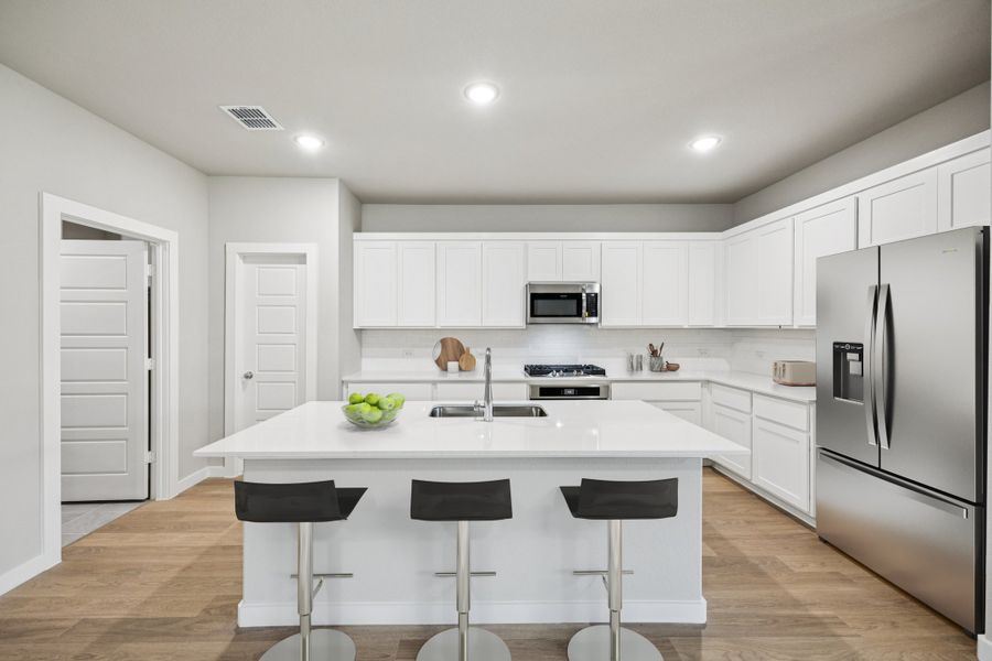 Kitchen in the Oscar home plan by Trophy Signature Homes – REPRESENTATIVE PHOTO Kitchen in the Oscar home plan by Trophy Signature Homes – REPRESENTATIVE PHOTO