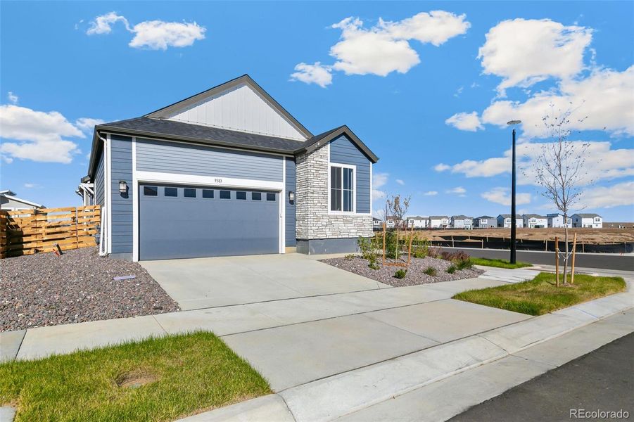 Front exterior of a new home in Legato, Commerce City, CO, highlighting curb appeal (Image 23).