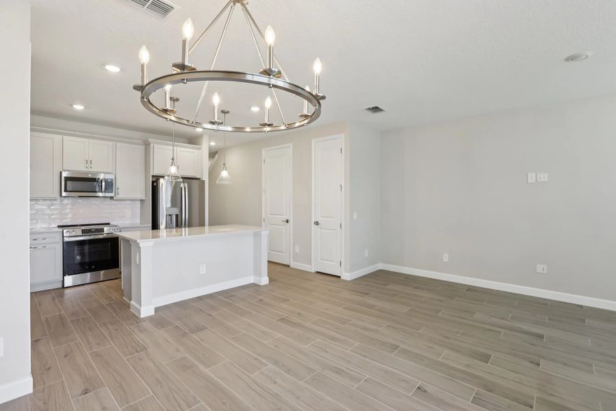 Open concept plan allows for seamless transition between kitchen, living and dining spaces