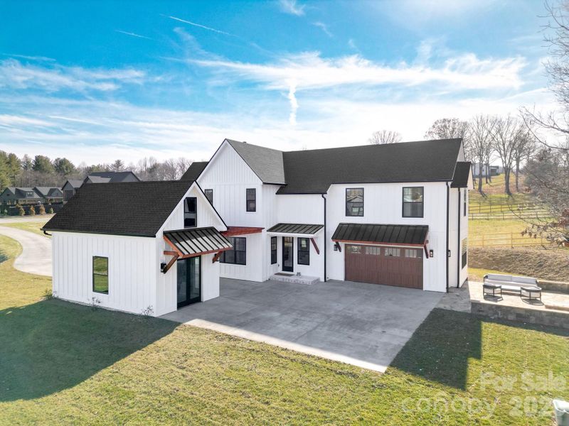 Front exterior of a new home in , Mills River, NC, highlighting curb appeal (Image 25).