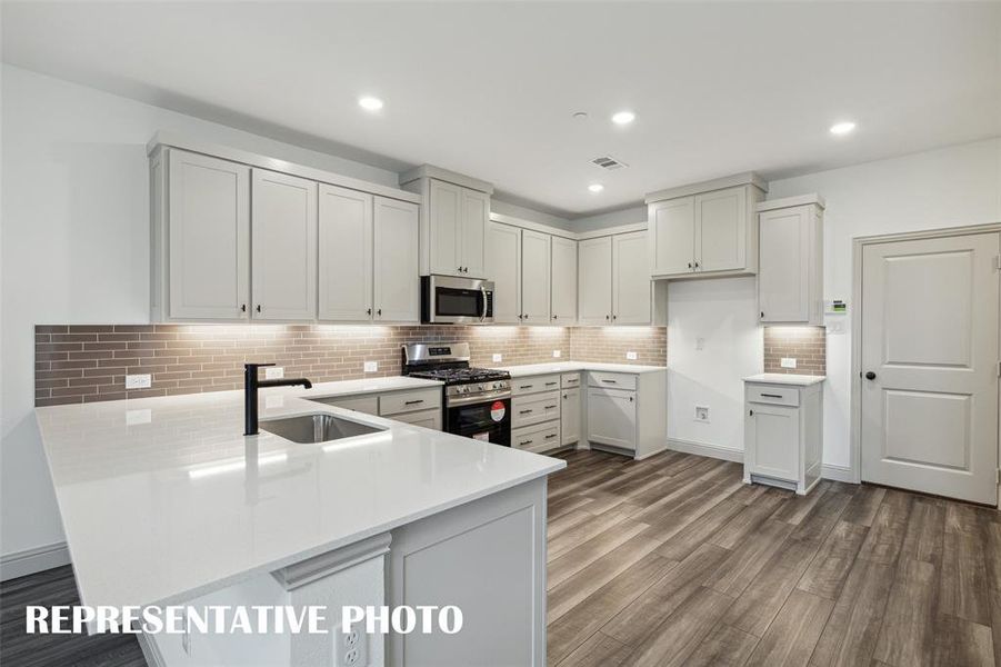 No shortage of space, storage or style in this dream kitchen!  REPRESENTATIVE PHOTO