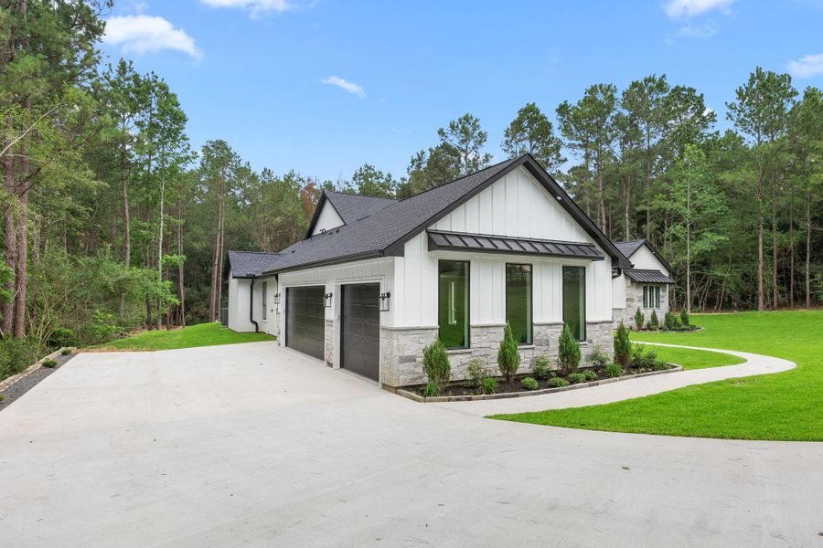 Front exterior of a new home in , Montgomery, TX, highlighting curb appeal (Image 27).