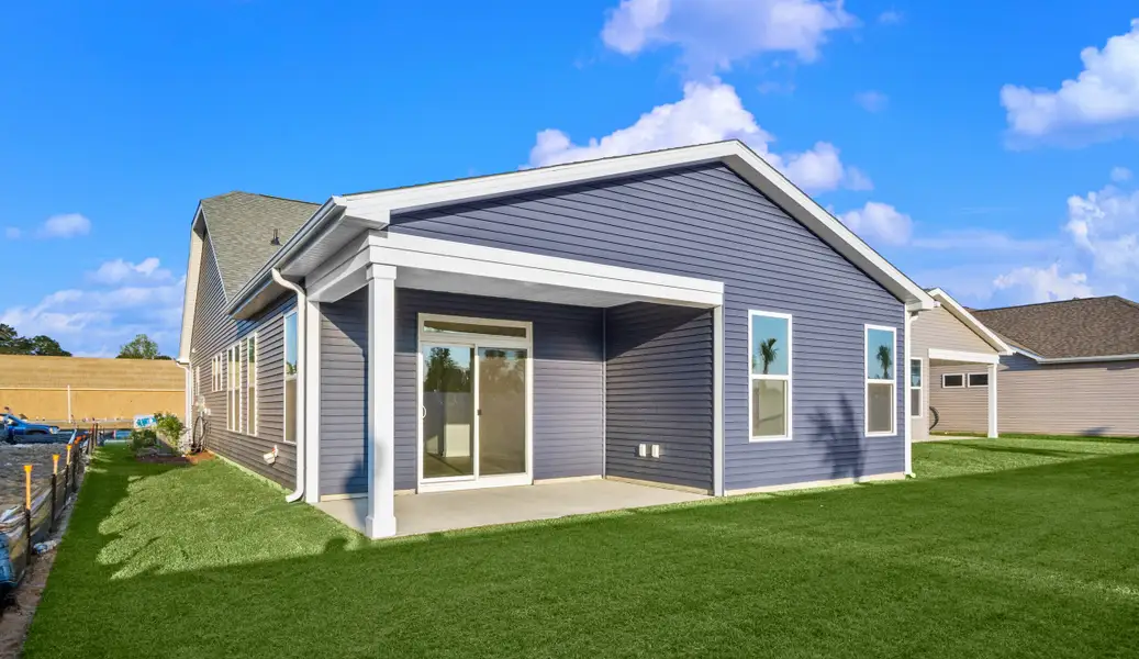 Exterior details and patio area of a home in Coastal Club of the Carolinas, Calabash (Image 3).