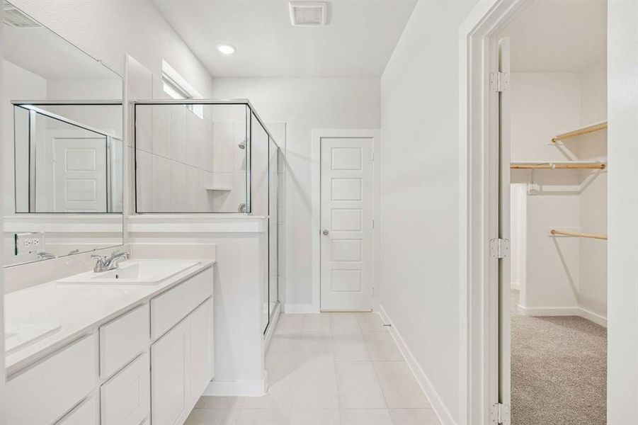 Primary Bathroom in the Stanley II home plan by Trophy Signature Homes – REPRESENTATIVE PHOTO