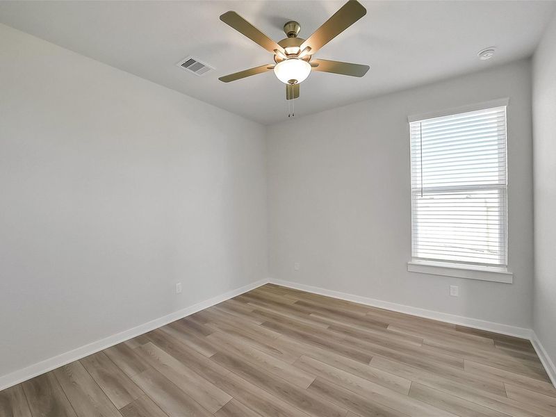 Spacious, unfurnished interior of a new home in Sunterra, Katy (Image 38).