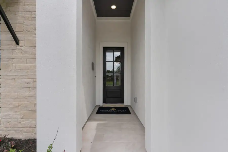 Exterior details and patio area of a home in The Colony- Pine Cove, Bastrop (Image 3).
