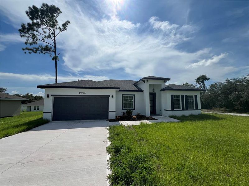 Front exterior of a new home in , Ocala, FL, highlighting curb appeal (Image 2).