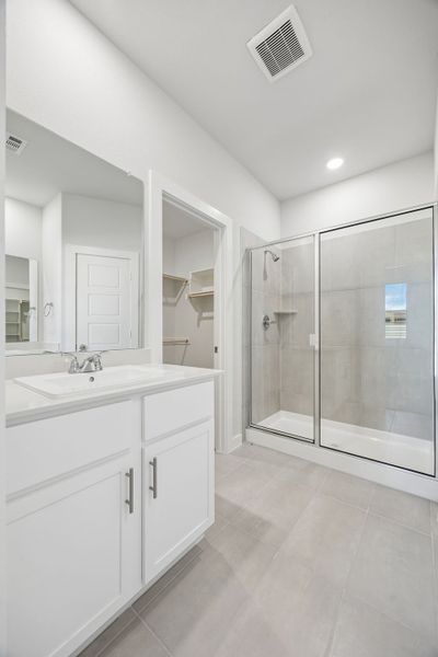 Primary Bathroom in the Birch home plan by Trophy Signature Homes – REPRESENTATIVE PHOTO