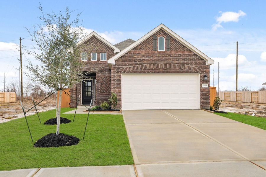 Front exterior of a new home in River Ranch Trails, Angleton, TX, highlighting curb appeal (Image 2). Front exterior of a new home in River Ranch Trails, Angleton, TX, highlighting curb appeal (Image 2).