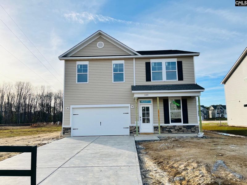Front exterior of a new home in Blythewood Farms, Blythewood, SC, highlighting curb appeal (Image 1). Front exterior of a new home in Blythewood Farms, Blythewood, SC, highlighting curb appeal (Image 1).