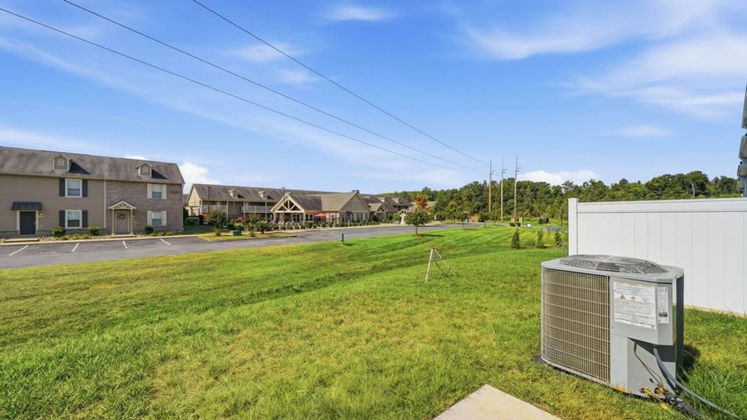 Exterior details and patio area of a home in The Arbor Townhomes, Kingsport (Image 3).