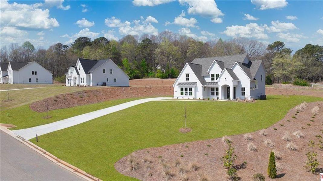 Front exterior of a new home in , Gainesville, GA, highlighting curb appeal (Image 31).