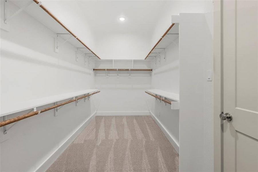 Large walk in closet in primary bathroom