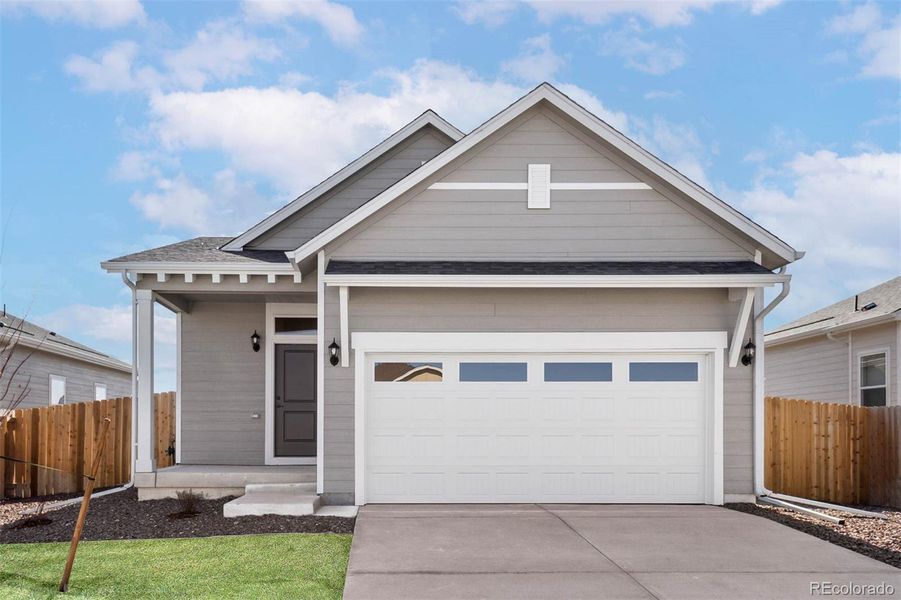 Front exterior of a new home in Second Creek Farm, Commerce City, CO, highlighting curb appeal (Image 1).