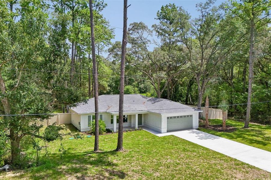 Front exterior of a new home in , Citrus Springs, FL, highlighting curb appeal (Image 2). Front exterior of a new home in , Citrus Springs, FL, highlighting curb appeal (Image 2).